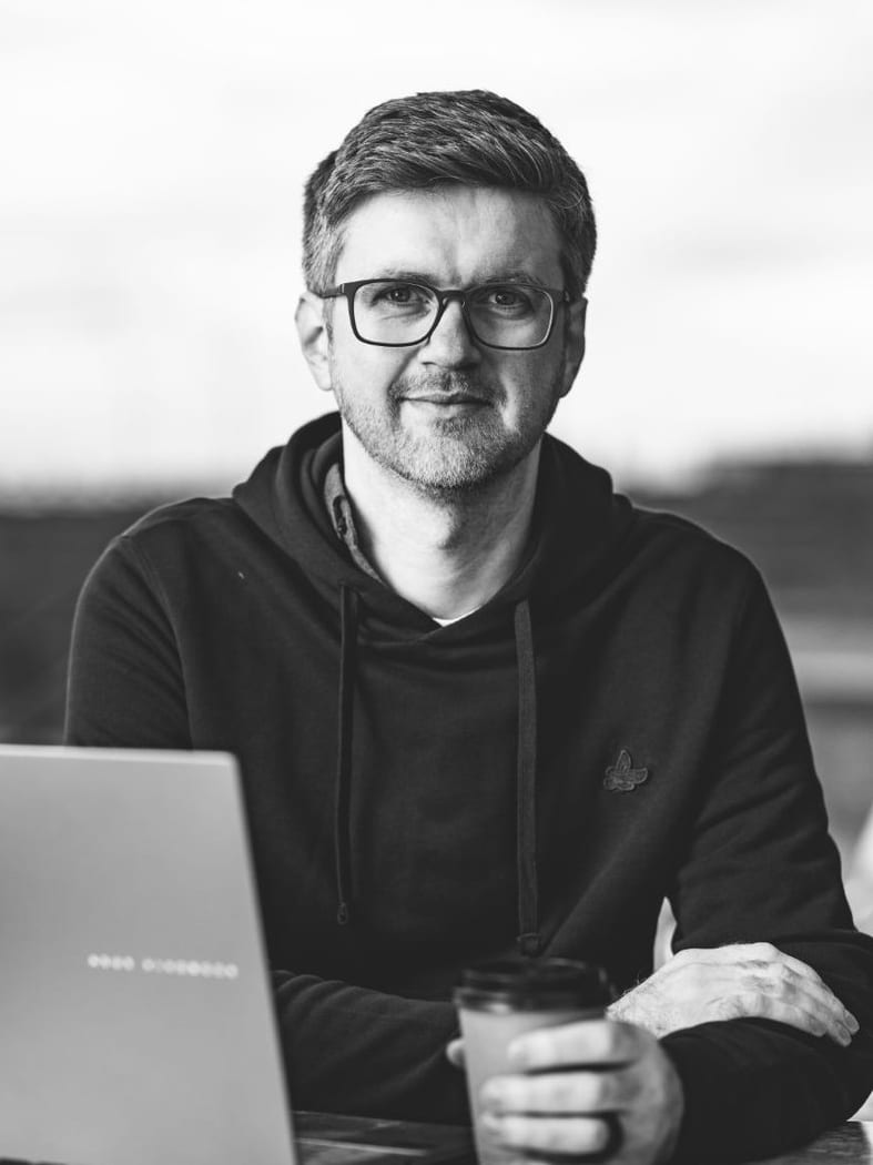Ian Ferguson, freelance ecommerce SEO consultant, working at a laptop